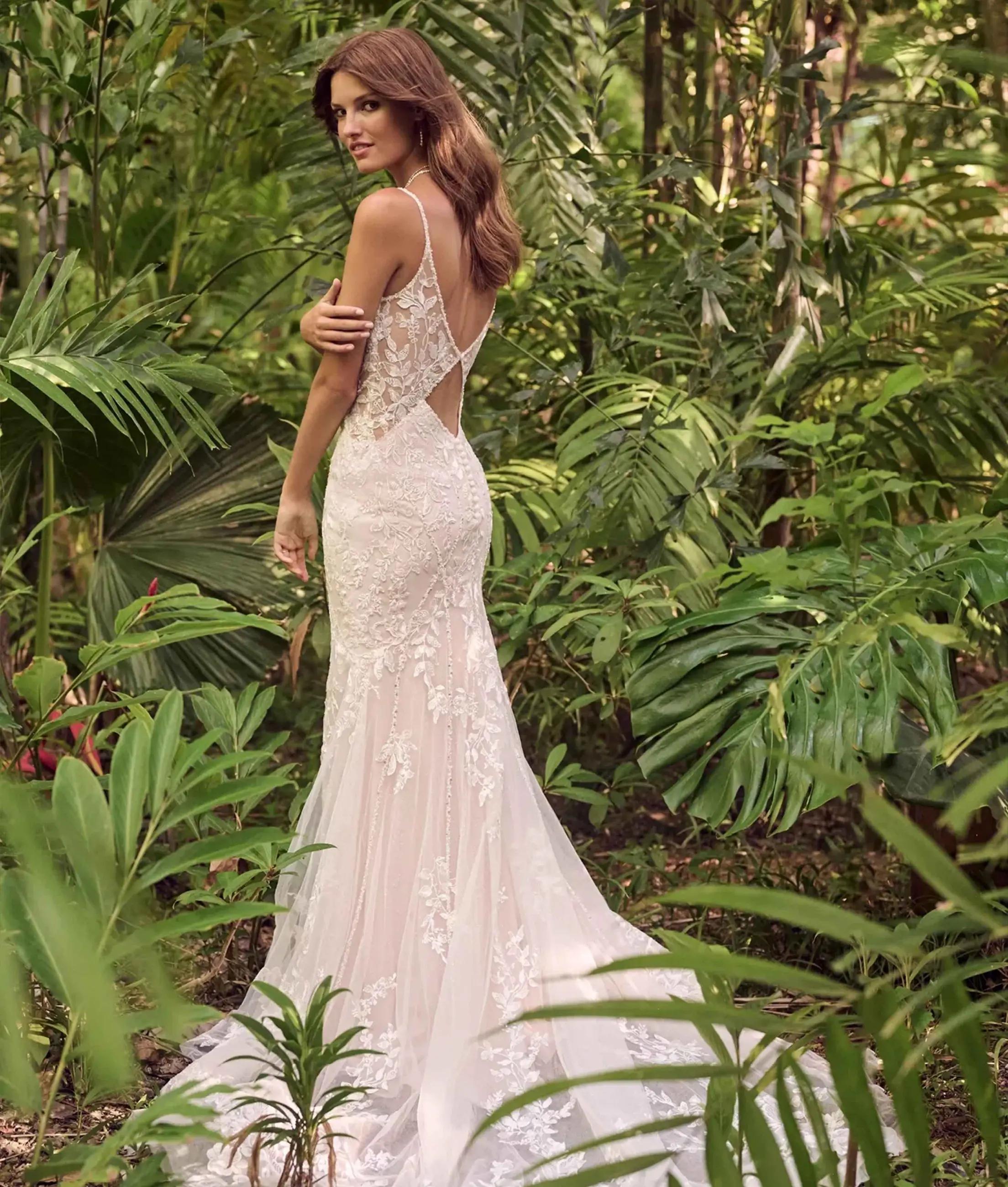 Model wearing a Maggie Sottero suit