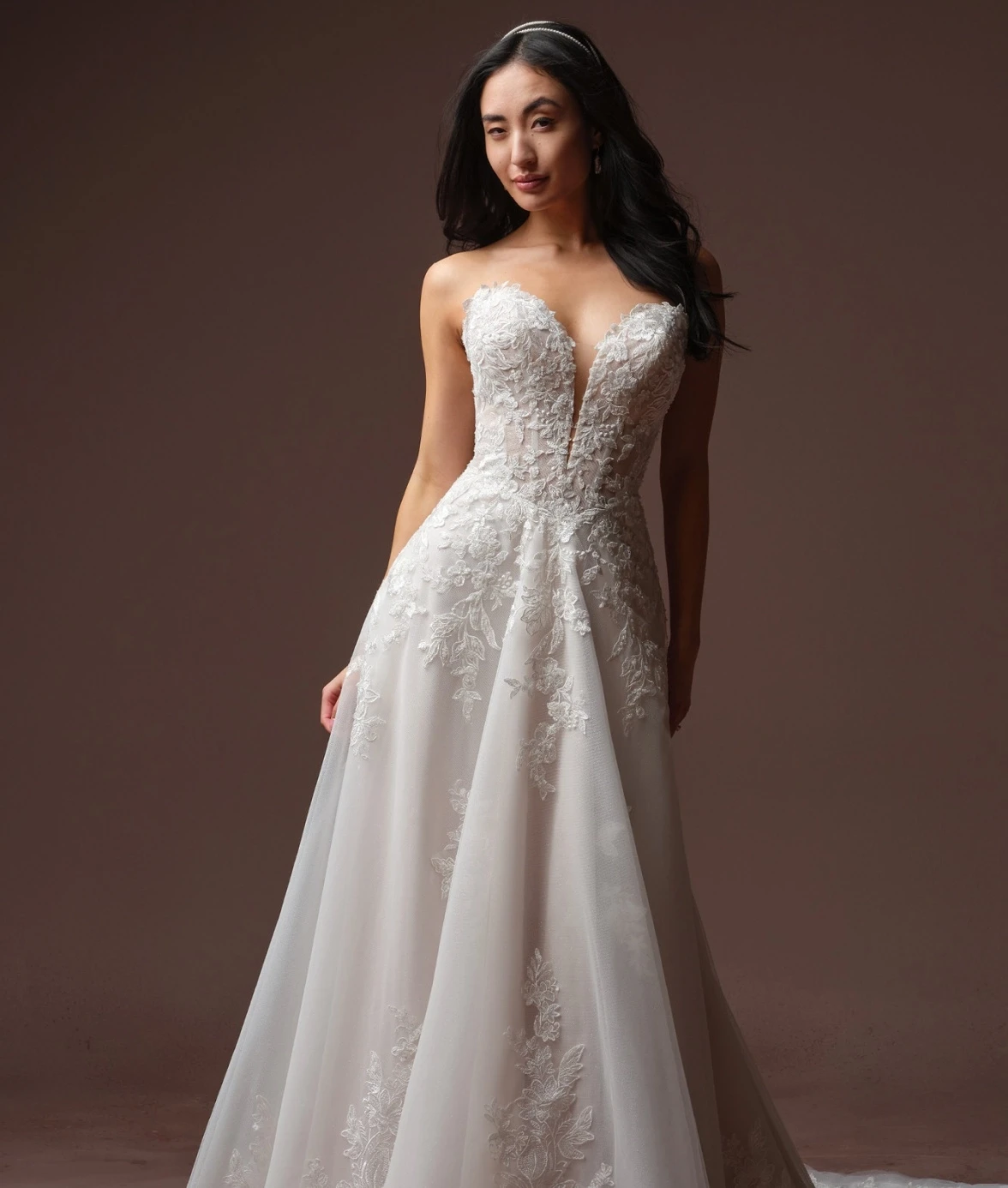 Model wearing a Rebecca Ingram wedding dress